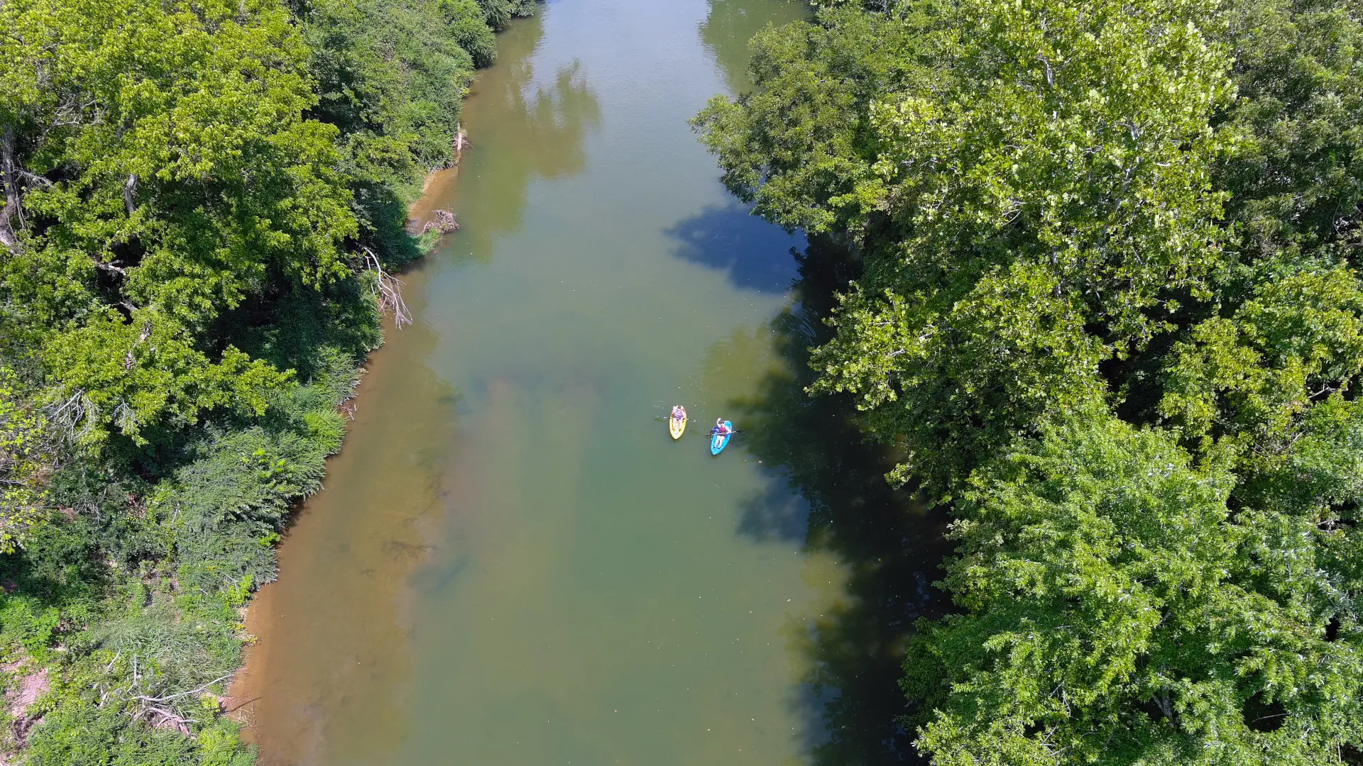 Two people kayaking on the Polk Bayou.